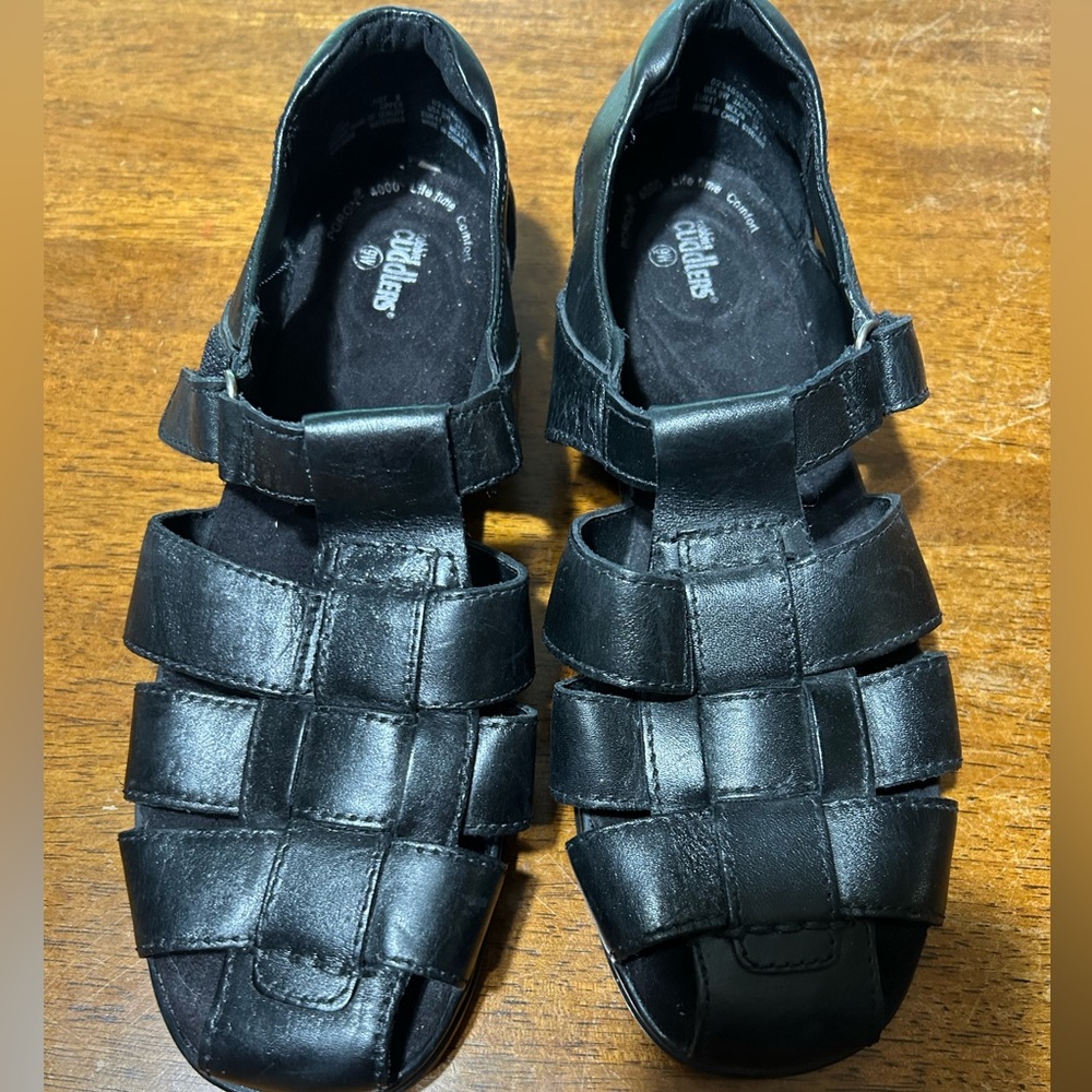 Cobbie cuddler black leather sandles. Velcro closures.